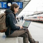 Flashpacker traveler carrying backpack and tech gear.