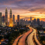 Kuala Lumpur skyline with Petronas Towers during sunset.